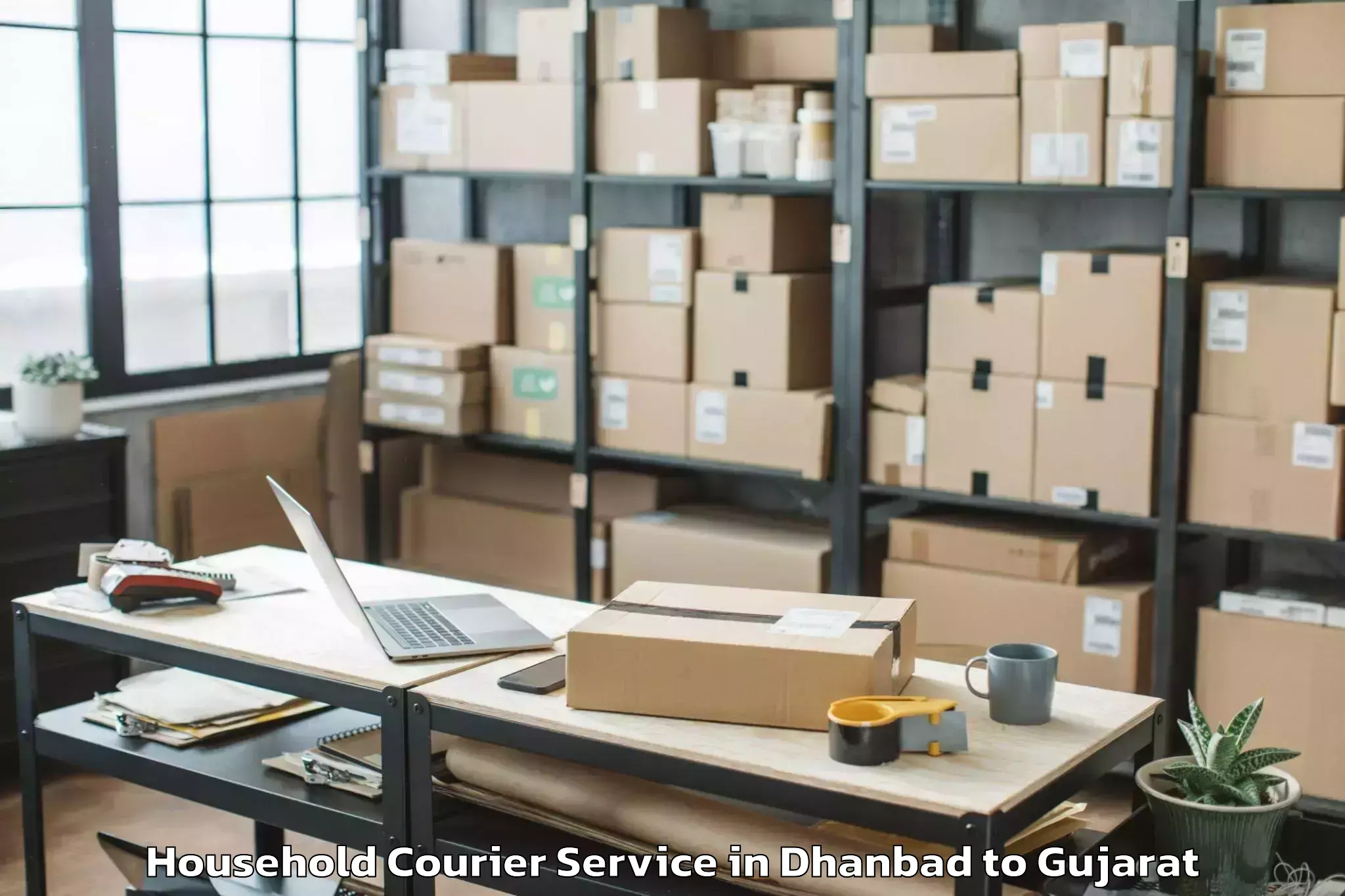 Dhanbad to Kamdhenu University Gandhinaga Household Courier